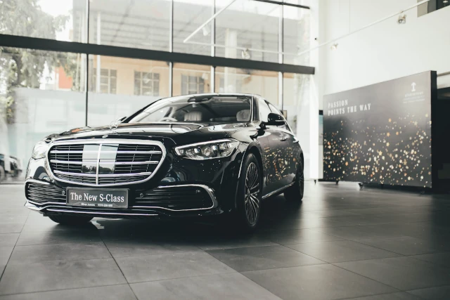 A Mercedes Benz car in a showroom. 