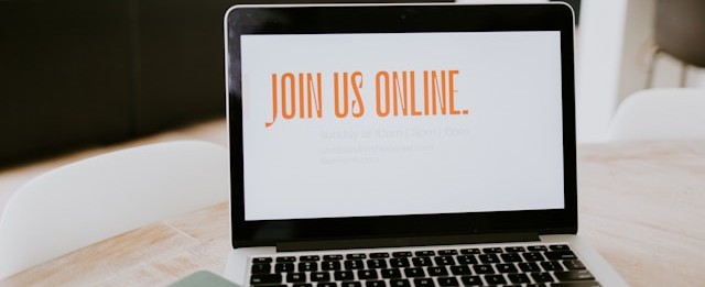 A photo of a laptop with the words Join us Online on the screen.